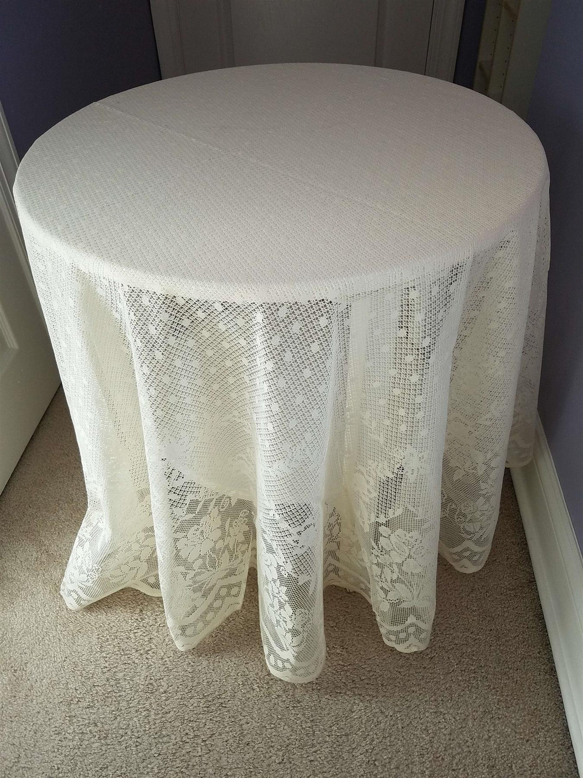 Elegant 70-inch round lace tablecloth with vintage floral pattern. Perfect for weddings, parties & special events. Shop AdonisUSA.